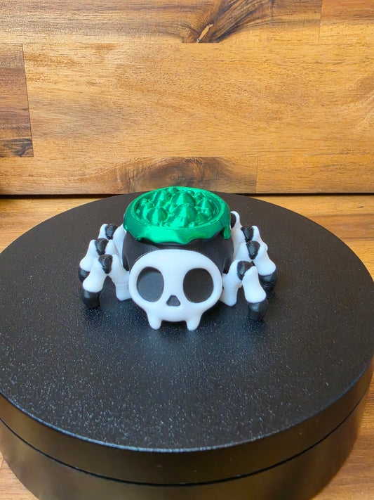 The Creepy Crawly Cauldron – Wiggly Skull Spider 🕷️💚✨